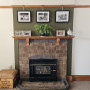 Fireplace, fireplace with wall behind featuring Resene Waiouru, brick and olive green fireplace
