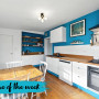 White kitchen painted with blue feature wall