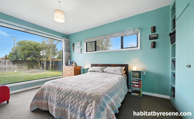 Master bedroom painted in serene green