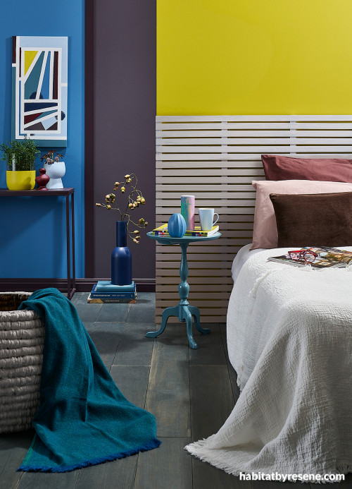 Bedroom featuring bright yellow and blue walls