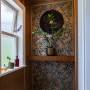 Corner window and walls featuring Resene metallic and teal floral wallpaper