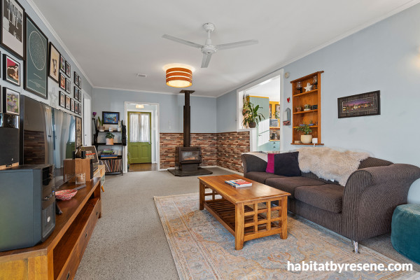 Living room featuring crisp blue walls.