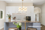 White kitchen with light grey kitchen island