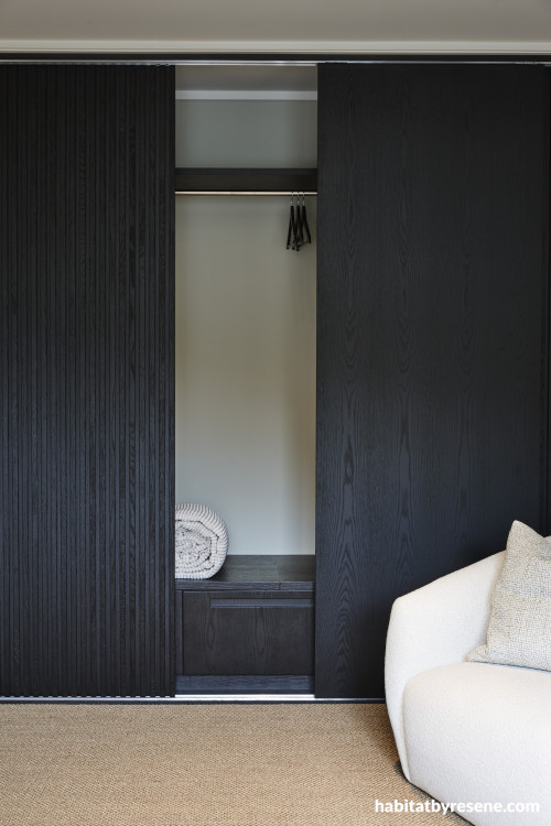 A cupboard with dark stained doors