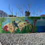 Outdoor mural featuring native birds and nature