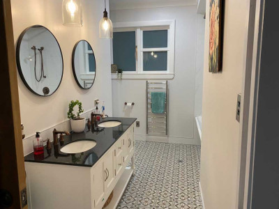 A country bungalow gets a second life with gorgeous greys and youthful blues and greens