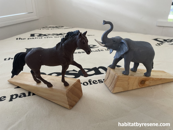 Plastic animals on door stops
