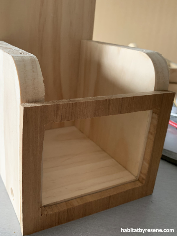 A wooden project with a square front