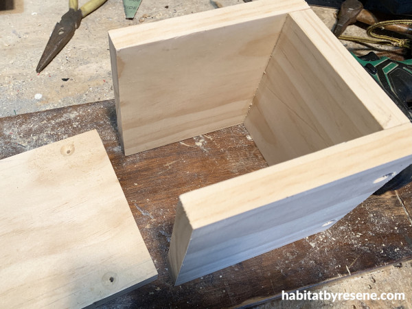 three sides of a wooden box
