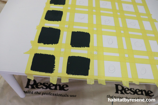 A yellow tape and black checkered board
