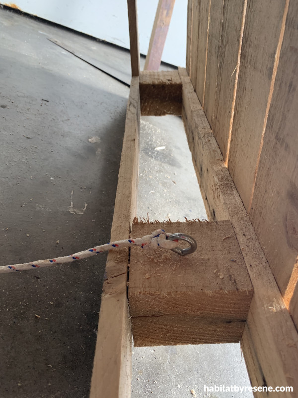 Rope tied to an eyelet in wood