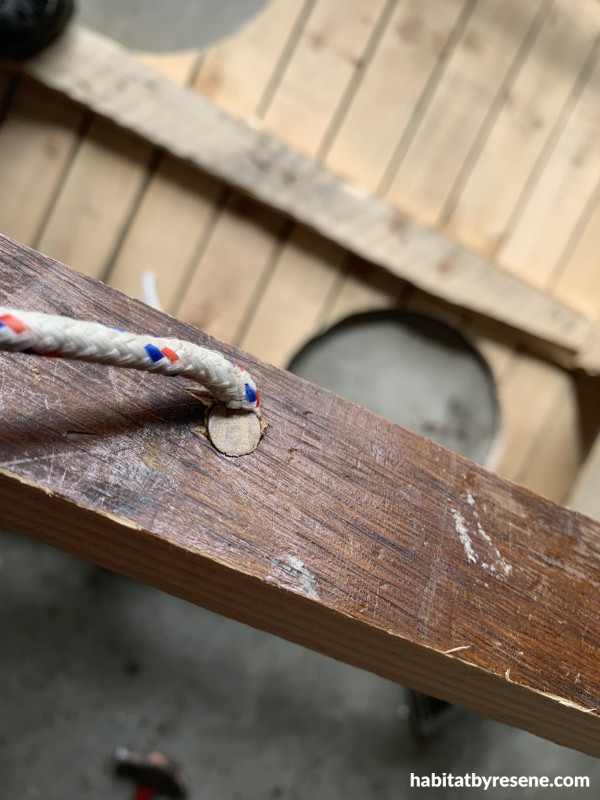 Rope through a hole in wood