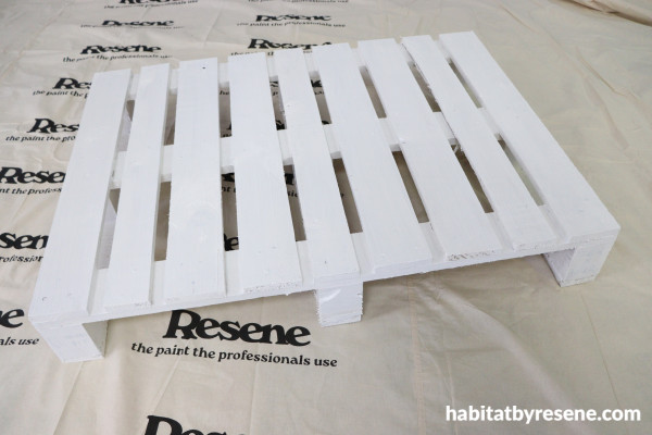 A pallet painted with white paint