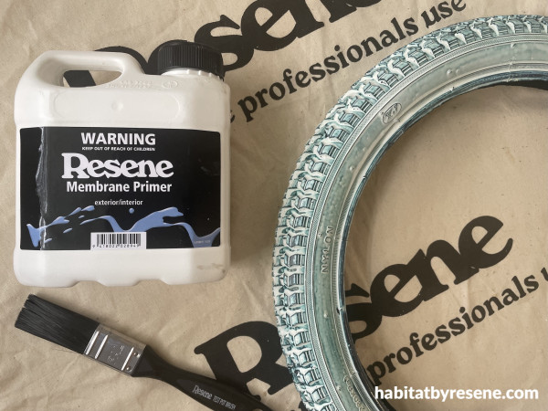 A tyre and paintbrush