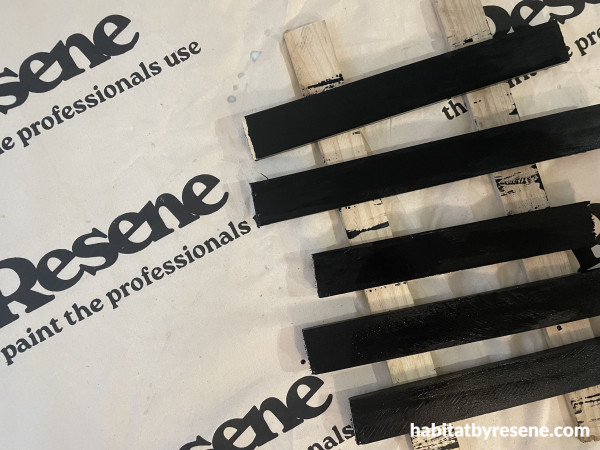 A group of black sticks on a cloth