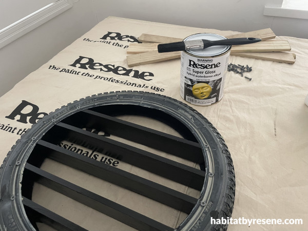 A paint can and a tire on a table