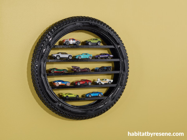 A display of toy cars on a tire