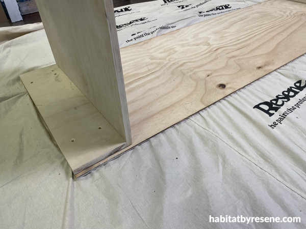Pieces of ply joined together with screws to create a wardrobe base