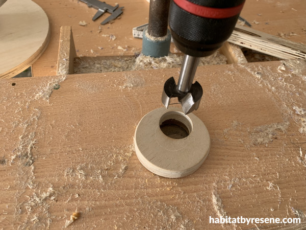 A round piece of wood with a circular hole in it