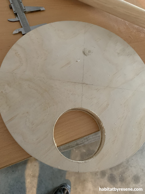 A circle made of wood with a circular hole in it