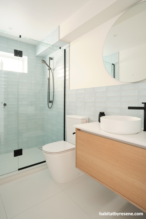 Bathroom featuring white neutral tones