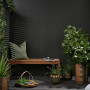 Dramatic dark outdoor patio featuring Resene Karaka
