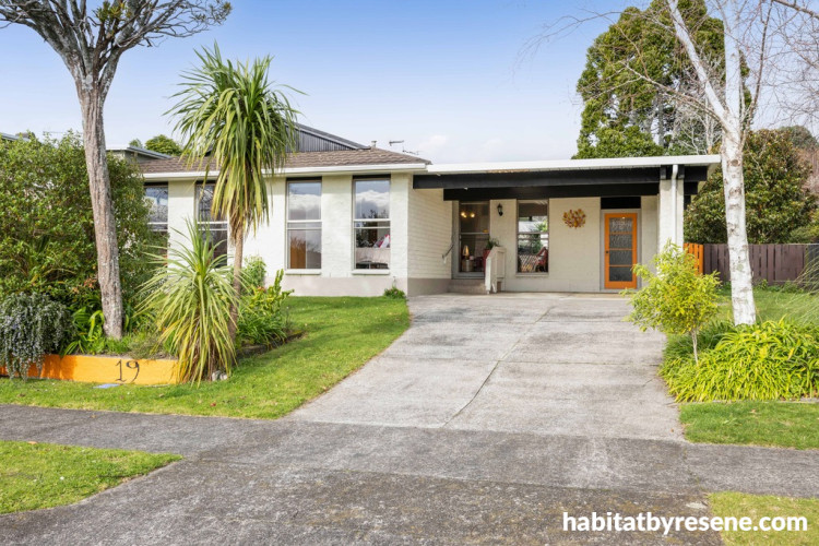 House exterior painted in Resene Spanish White with accents in Resene Black
