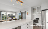 Kitchen and dining area painted in Resene Concrete