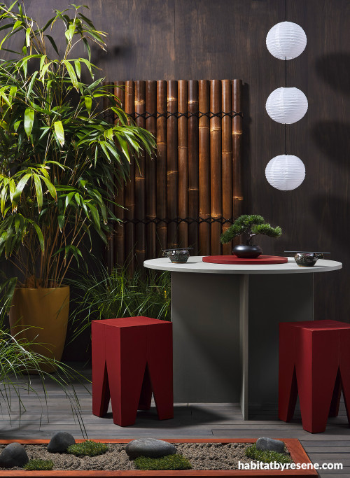 Japanese-inspired patio with walls stained in Resene Woodsman Charred Black