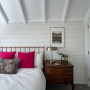 Guest bedroom in Resene Rice Cake with the ceiling highlighted in Resene Ceiling Paint White.