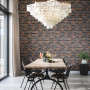 Dining room featuring wallpaper in a brick pattern