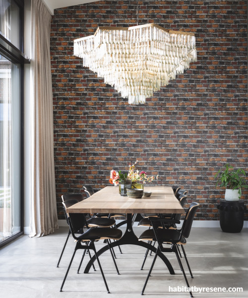 Dining room featuring wallpaper in a brick pattern