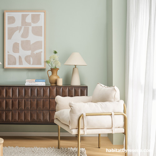 Living area painted in Resene Pumice and Resene Rice Cake with floor stained in Resene Colorwood Bask