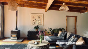 Living room painted in Resene Bianca and featuring a timber ceiling