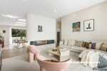 Living room painted in Resene Albescent White and Resene Eighth Thorndon Cream