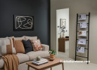 Living area with moody feature wall painted in Resene Nocturnal and side wall in Resene Quarter Akaroa