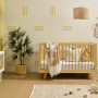 Nursery painted in Resene Double Villa White with stripes and left wall in Resene Putty