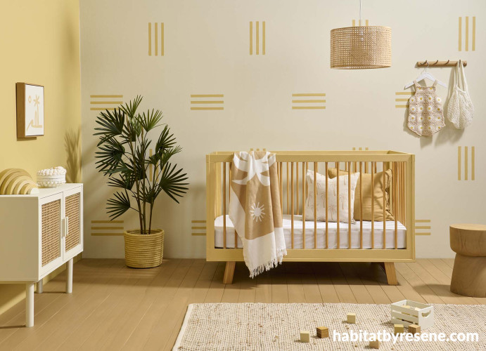 Nursery painted in Resene Double Villa White with stripes and left wall in Resene Putty
