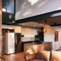 Kitchen with walls in Resene Black White and feature wall in Half Duck Egg Blue
