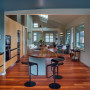 Hardwood natural floor in kitchen with blue walls
