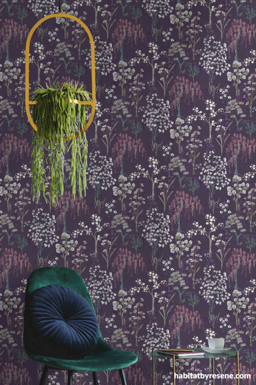 Wallpaper with violet tones creates moody meadow atmosphere in room