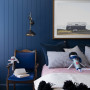 An inky, navy blue encompasses children's bedroom
