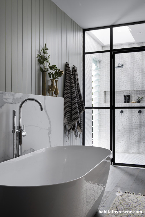 Bathroom in soft white and grey tones creates a luxurious atmosphere