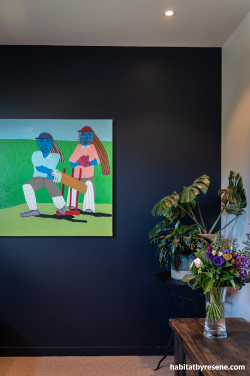 Feature wall painted in navy blue