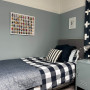 Light grey blue tone creates calming atmosphere in bedroom