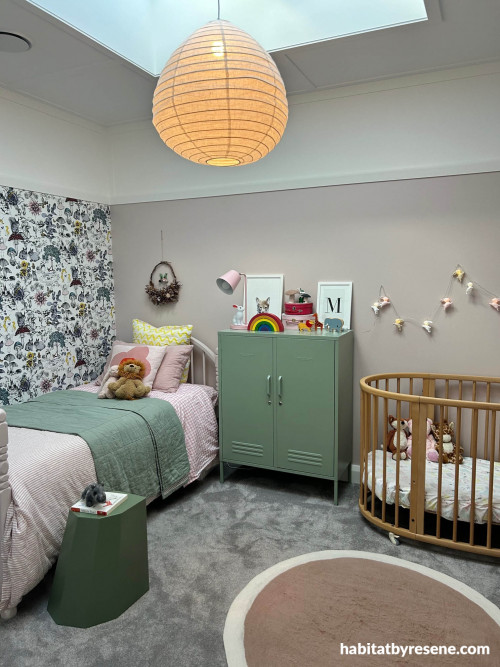 Soft dusty pink on lower wall and a creamy tone on upper wall in bedroom