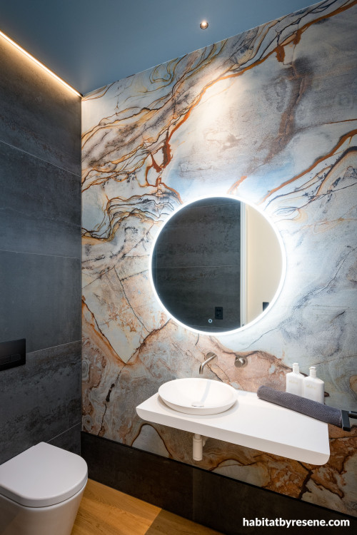 Luxurious bathroom drenched in moody tones