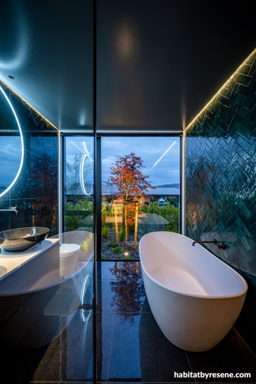 Moody tones in bathroom creates luxurious feel