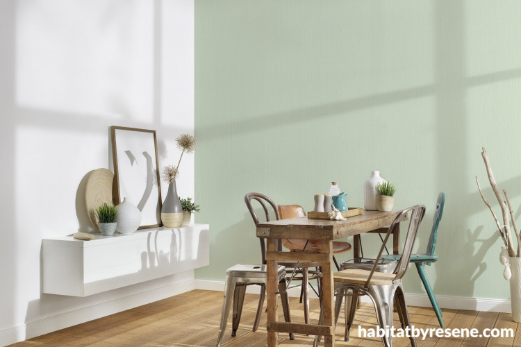 Dining space with gentle green wallpaper 