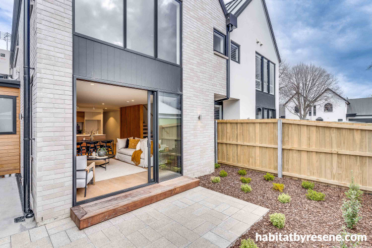 Home exterior painted in white tones makes for welcoming look